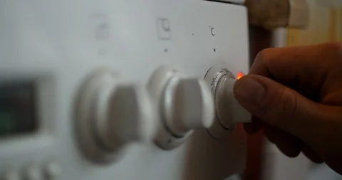 Using the Oven, oven temperature control closeup Stock Footage 86978708