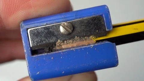 Using a pencil sharpener, Macro and Slow Motion Stock Footage 106212972