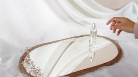 Using perfume from the bottle Stock Footage 137213907