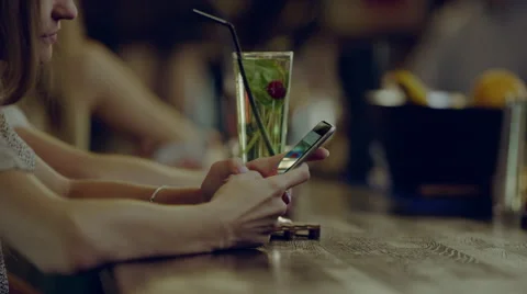 Using phone in the bar Stock Footage 67881136