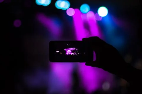 Using phone on concert Stock Photos