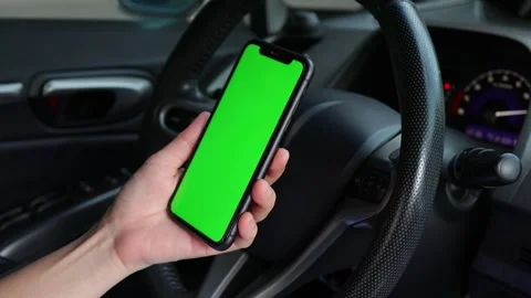 Using phone green screen at car 動画素材 249861557
