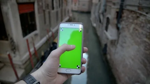 Using Phone with Green Screen In Venice Stock Footage 76823790