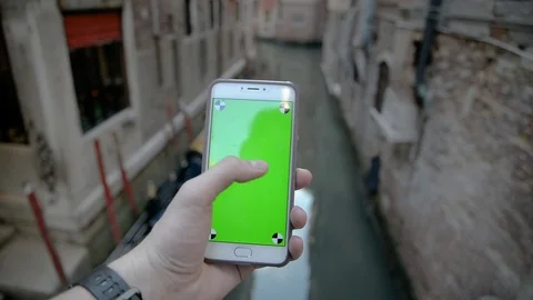 Using Phone with Green Screen In Venice Stock Footage 76823984