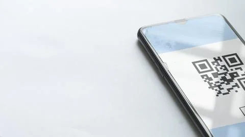 Using the phone to scan the qr code to pay. The concept of using a phone to t Stock Photos