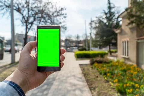 Using a phone on the street concept Stock Photos