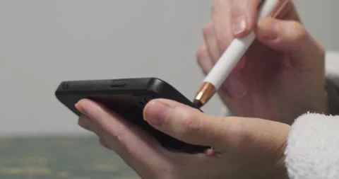Using phone with a touch pencil 4K video Stock Footage 298642895