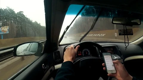 Using phone while driving Stock Footage 73200049