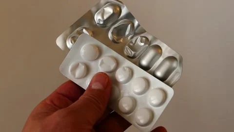 Using pills unnecessarily is not good for health, finished pill boxes in a pe Stock Footage 170518370