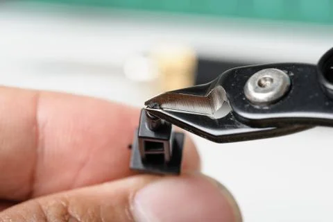 Using plastic nippers Stock Photos