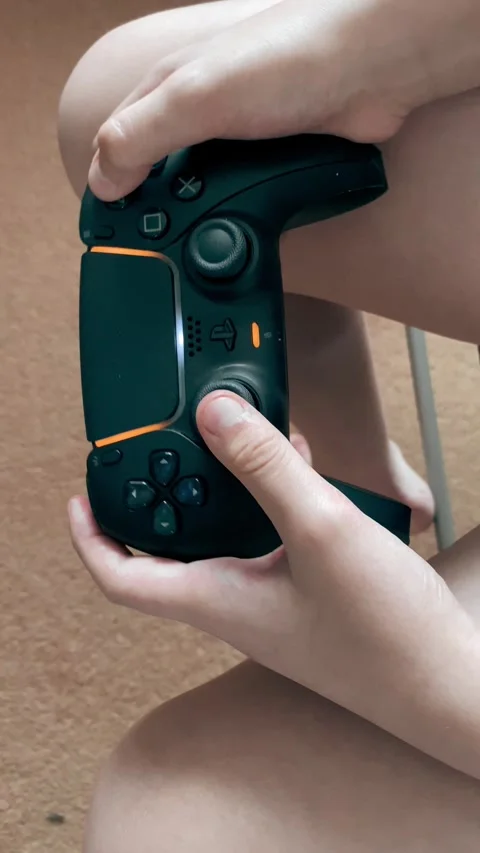 Using a Playstation Controller Stock Footage 240416709