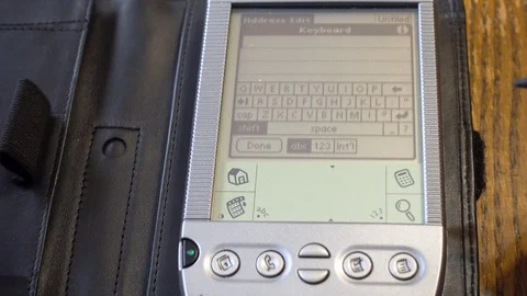 Using the pop up keyboard on an old Personal Digital Assistant (PDA) Stock-Footage 88452846