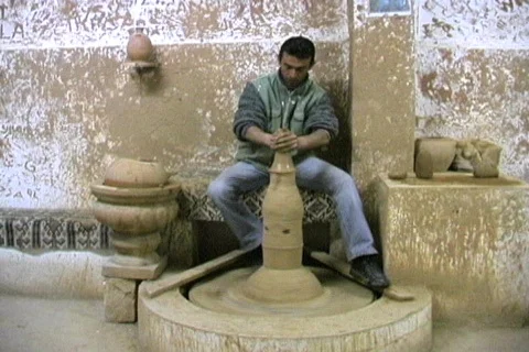 Using a pottery wheel to make a sugar bowl Stock Footage 110302