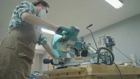 Using a Power Saw in a Workshop Stock Footage 333449548