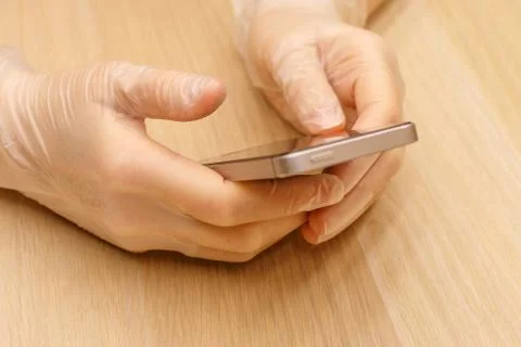 Using protective gloves with a mobile phone Stock Photos