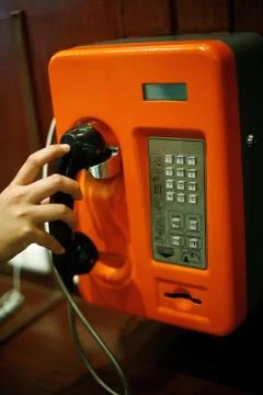 Using the public telephone Stock Photos