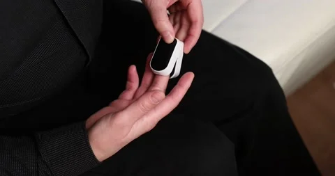 Using a pulse oximeter to check for coronavirus. Blood oxygen measurement Stock Footage 143974076