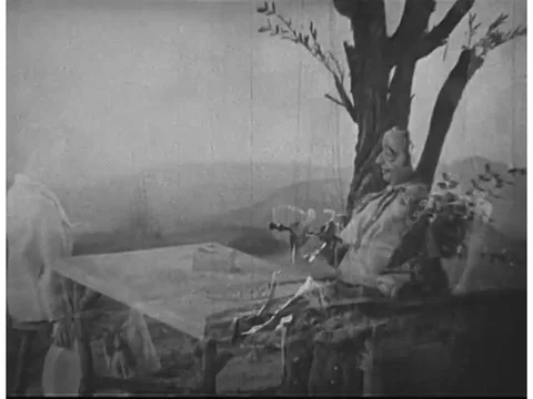 By using puppets of a young man and some goats, a scene from a 1930s film Stock Footage 75411076