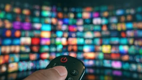 Using a remote to command a large-screen TV. Stock Footage 315542580
