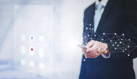 Using the remote to connect electrical appliances concept, Businessman holdin Stock Photos