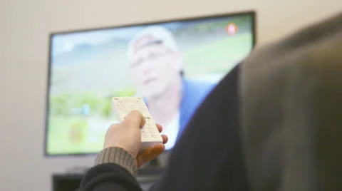 Using a remote control to change channels 스톡 동영상 22571748