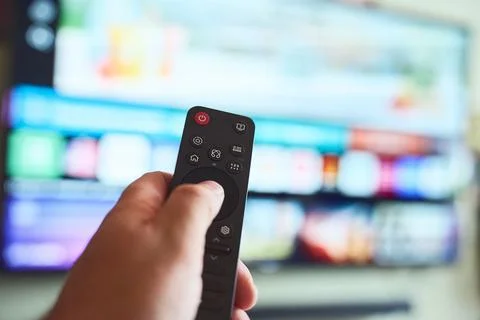 Using a remote control for entertainment Stock Photos