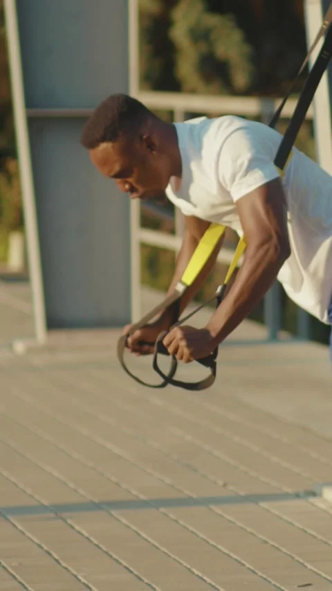 Using resistance bands in training routines to boost athlete performance and Stock Footage 316542645