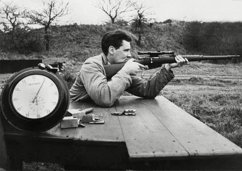 Using A Rifle Fitted With A Telescope Sight An Attempt To Fire Three Shots In Mi Stock Photos
