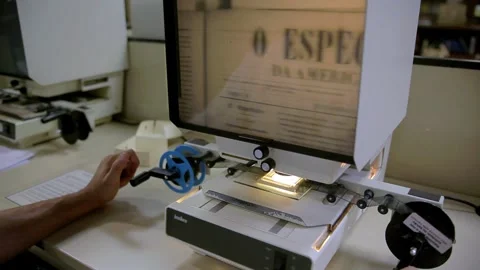 Using roll film microfilm reader to view photographed printed materials, Stock Footage 251863169