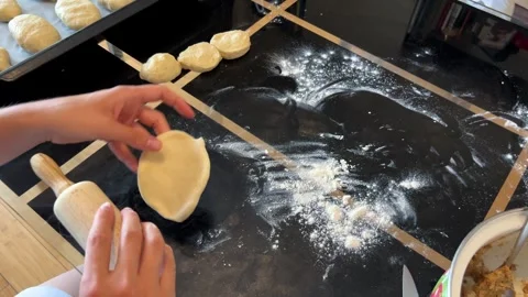 Using a rolling pin, the person is preparing dough for a delicious dish Vídeo Stock 269997583