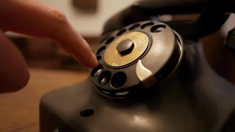 Using a Rotary Dial Telephone and Dialing the Number 動画素材 309481792