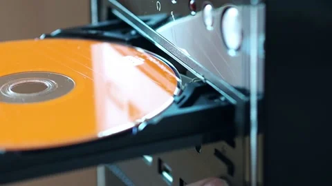 Using a round CD in an old computer's drive Stock Footage 237736720