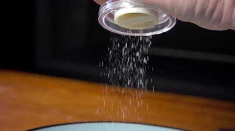 Using salt mill, slow motion Stock Footage 55246579