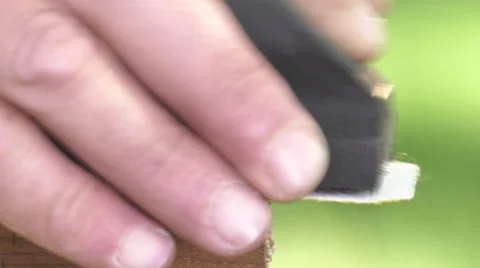 Using a sanding block on the edge of a board Video stock 63506168