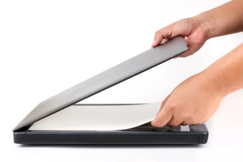 Using scanner in office, close-up of hands scanning documents Foto stock