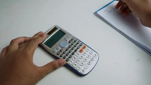 Using a Scientific Calculator for Math Calculations Stock Footage 320725205