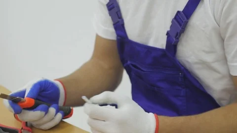 Using screwdriver for take apart of electrical plug Stock Footage 81545480