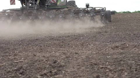 Using a seeder to plant soybeans in a field. Slow motion Stock Footage 275167774