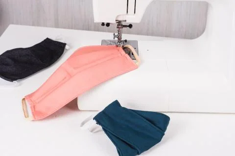 Using the sewing machine to sew the face mask during.the coronavirus pandemia Stock Photos