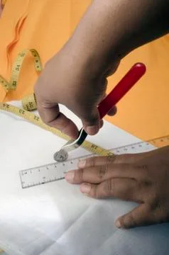 Using Sewing Tracing Wheel on White Fabric. Stock Photos
