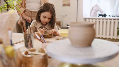 Using the sharp tools to shape the clay. Video stock 243827187