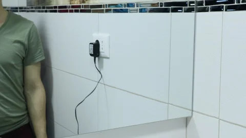 Using the shaving machine in the bathroom, mirror view Stock Footage 128605397