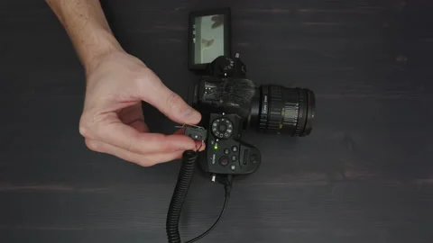 Using shutter release cable on mirrorless camera to take photos Stock Footage 237145394