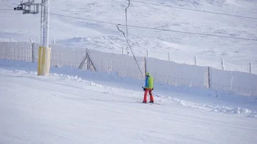 Using ski lift in ski slope track winter slow motion Stock Footage 85765244
