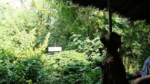 Using slingshot to shoot cans Stock Footage 121499394