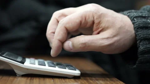 Using small calculator, Slow Motion Stock Footage 58934704