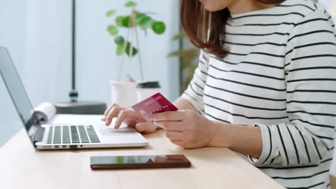 Using smart cell phone for online shopping with credit card on living room Stock Footage 265931277