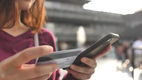 Using smart cell phone for online shopping with credit card on living room Stock Footage 265931852