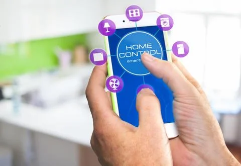 Using smart home app on phone. Smart home control concept. Stock Photos