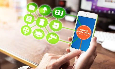 Using smart home app on phone. Smart home control concept. Stock Photos